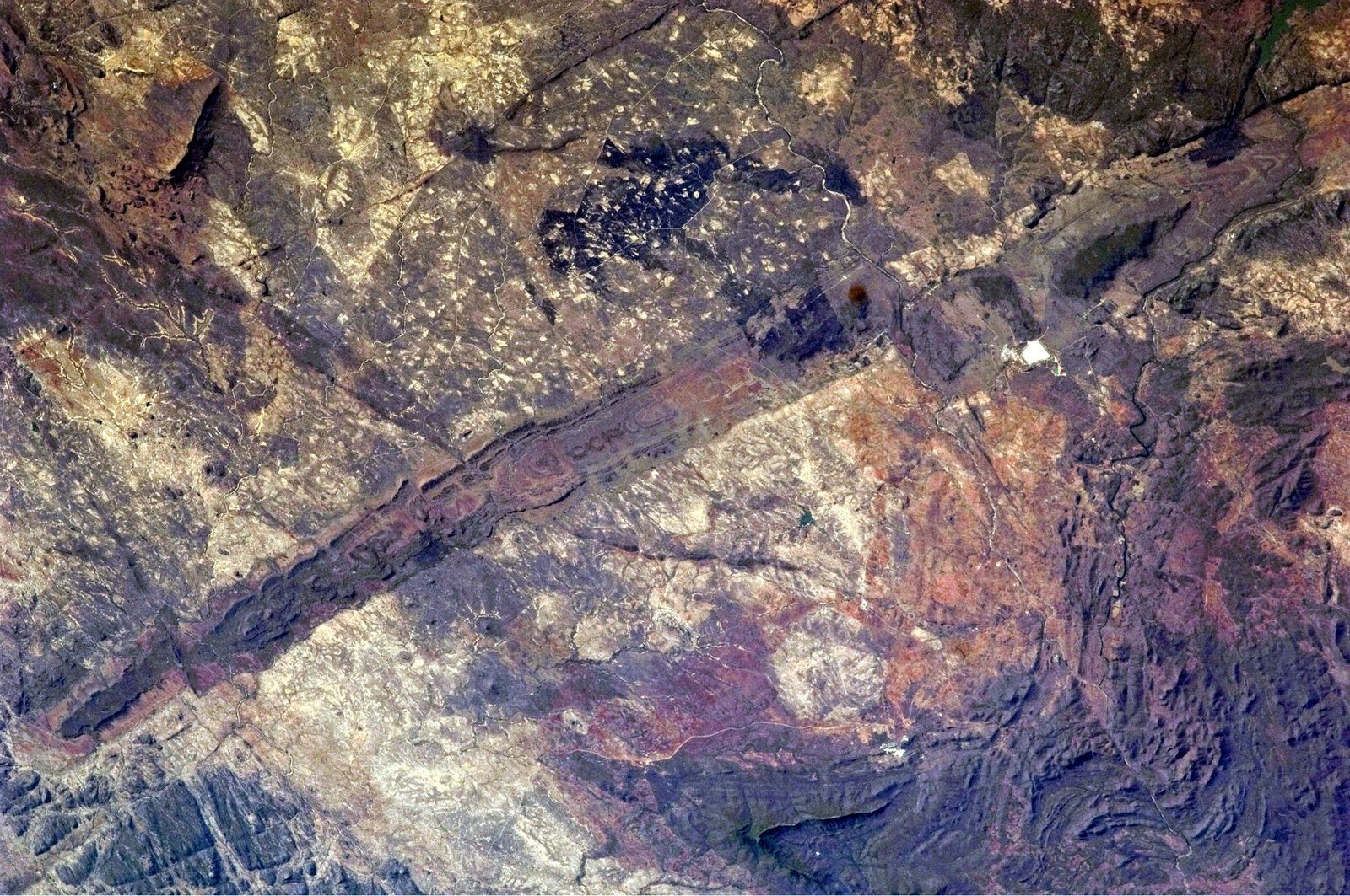 The Great Dyke of Zimbabwe seen from the International Space Station: a dark band of mineral-rich rock running diagonally across the land